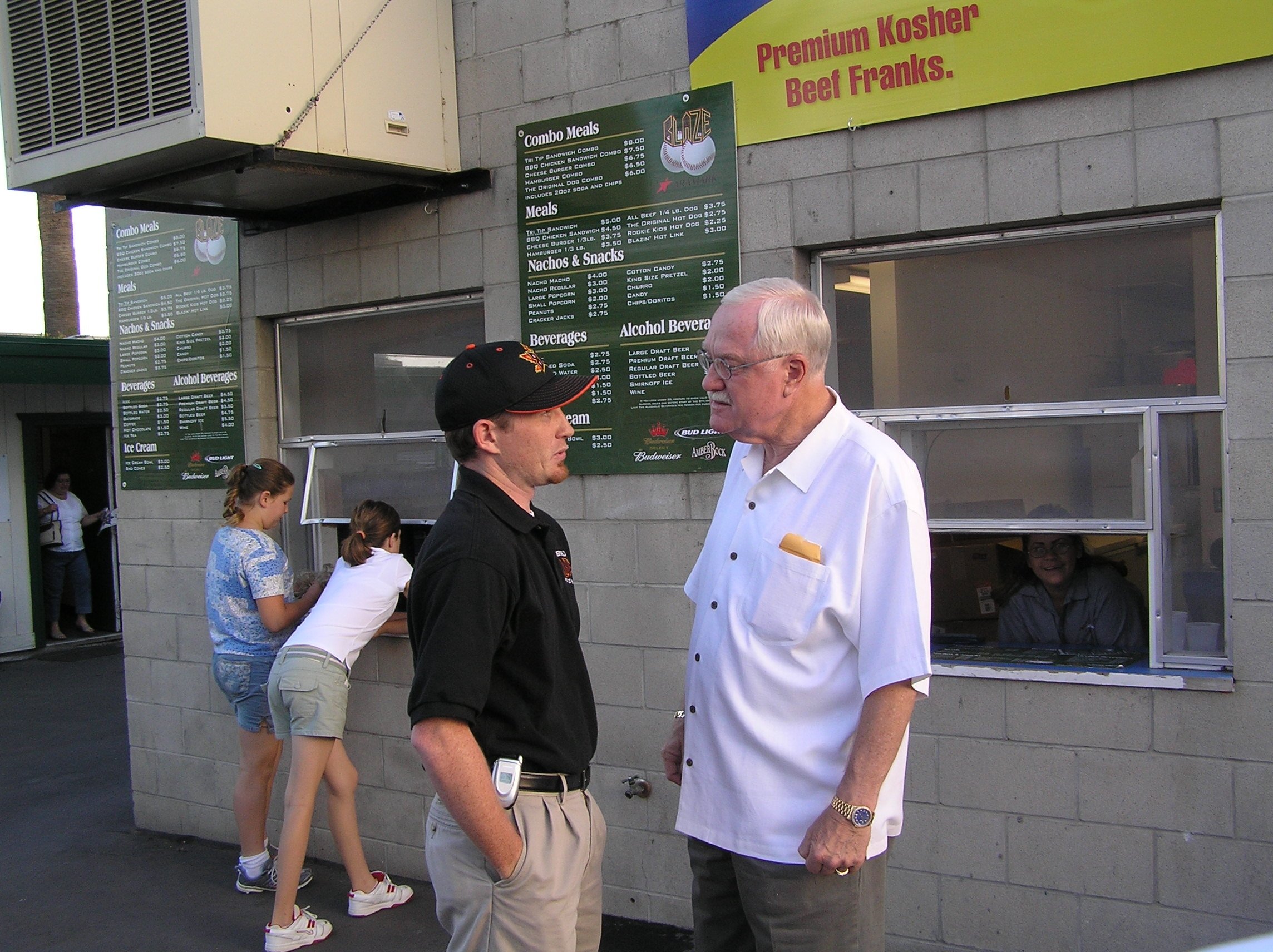Brian and former Bakersfield mayor Harvey Hall talking baseball at a Bakersfield Blaze game. 